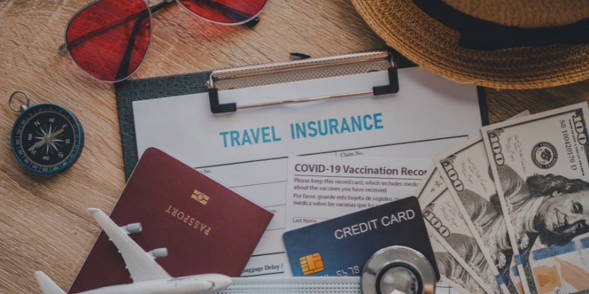 Flat lay of travel insurance papers, passport, vaccination card, and money for safe eco-travel in Malaysia
