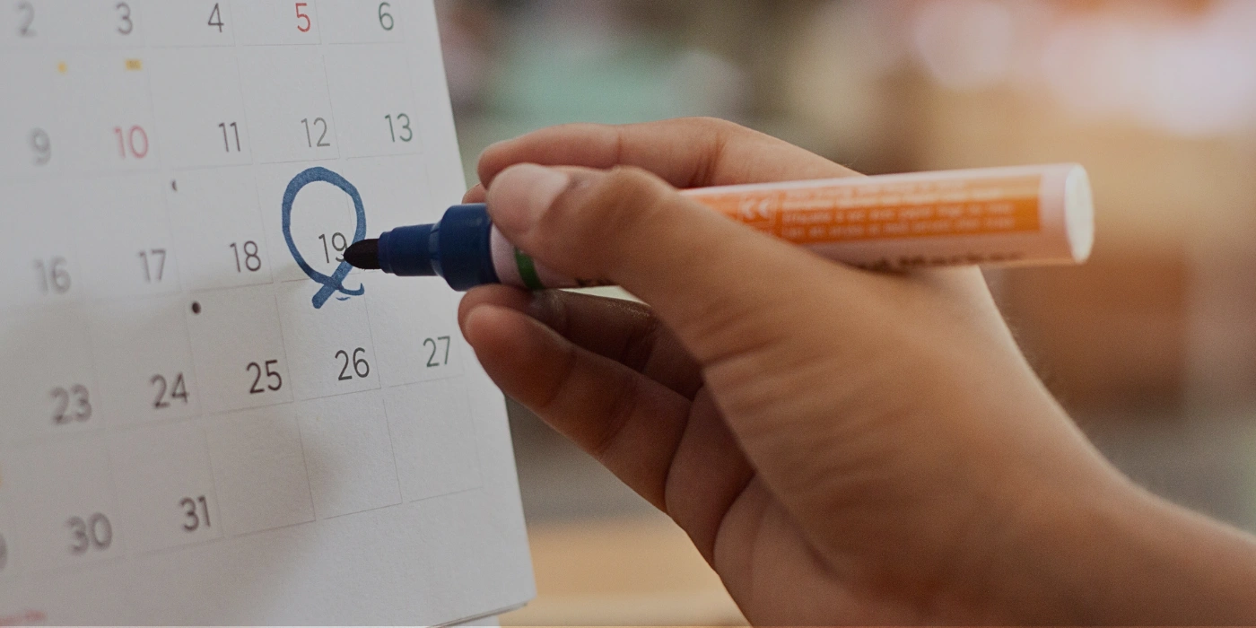 A calendar with marked travel dates, highlighting the best time to visit Taman Negara National Park in Malaysia for eco-conscious travelers