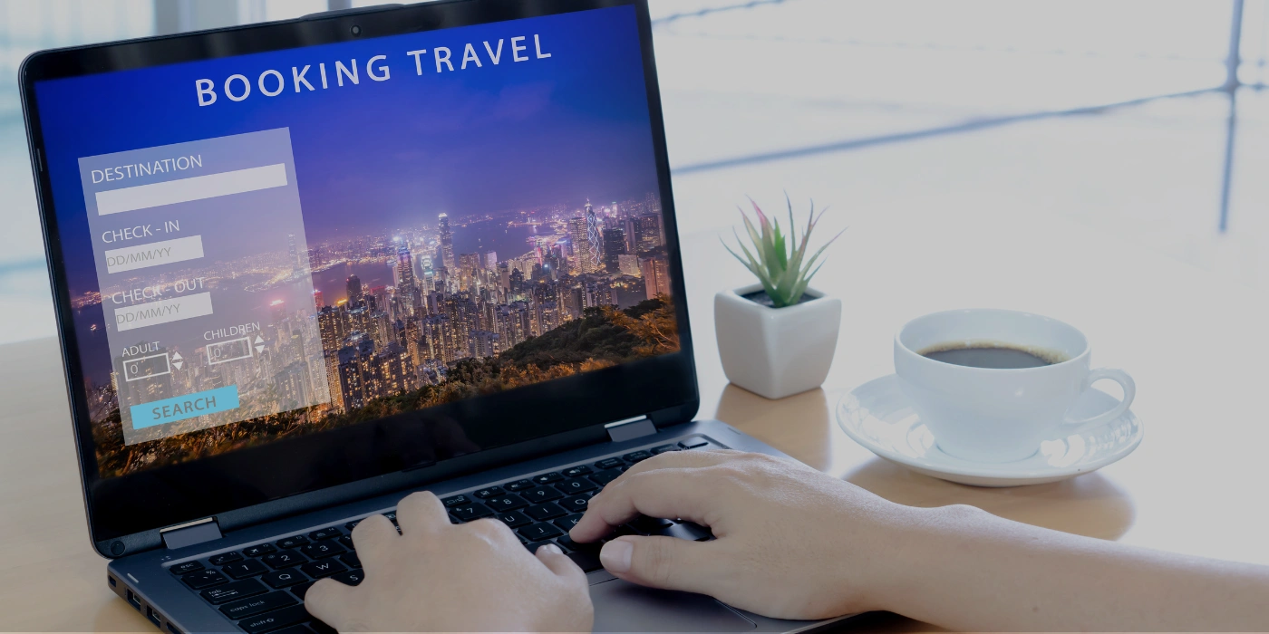 A person using a laptop to book a rapid shooting tour in Taman Negara