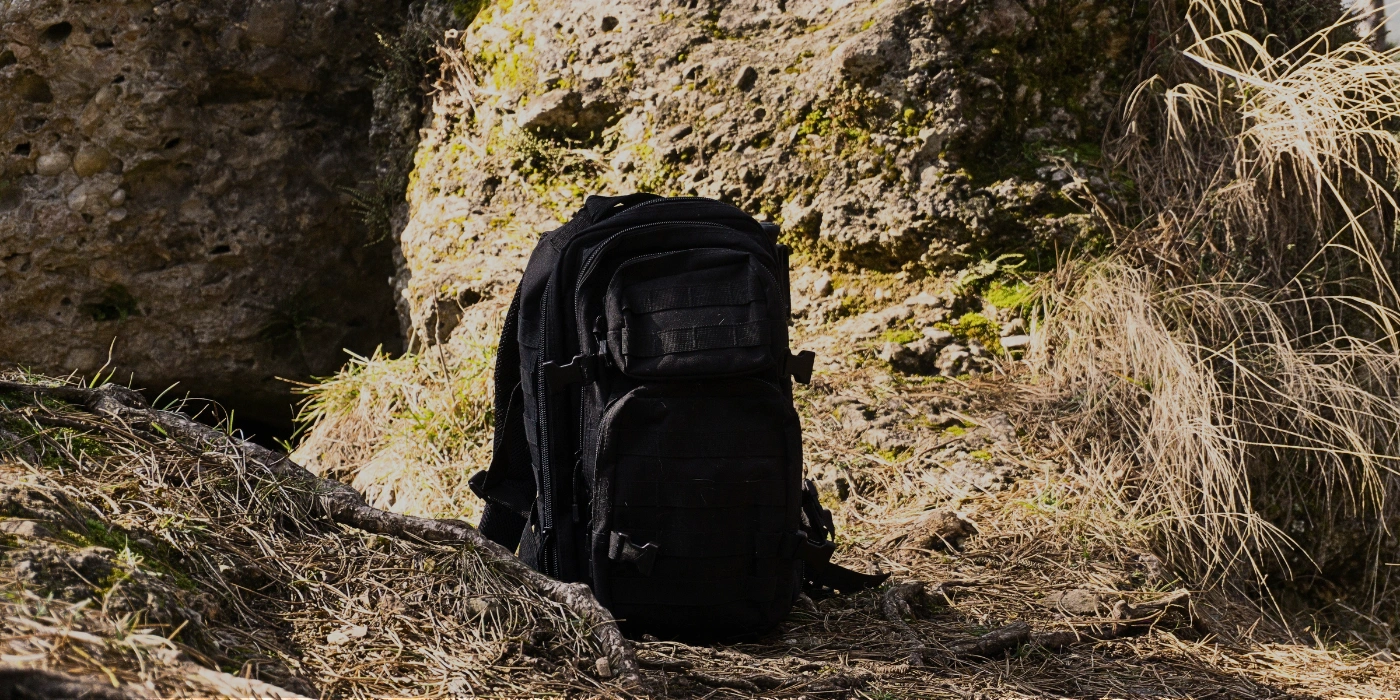 Waterproof daypack resting on forest ground, packed for a day of trekking in Tabin Wildlife Reserve