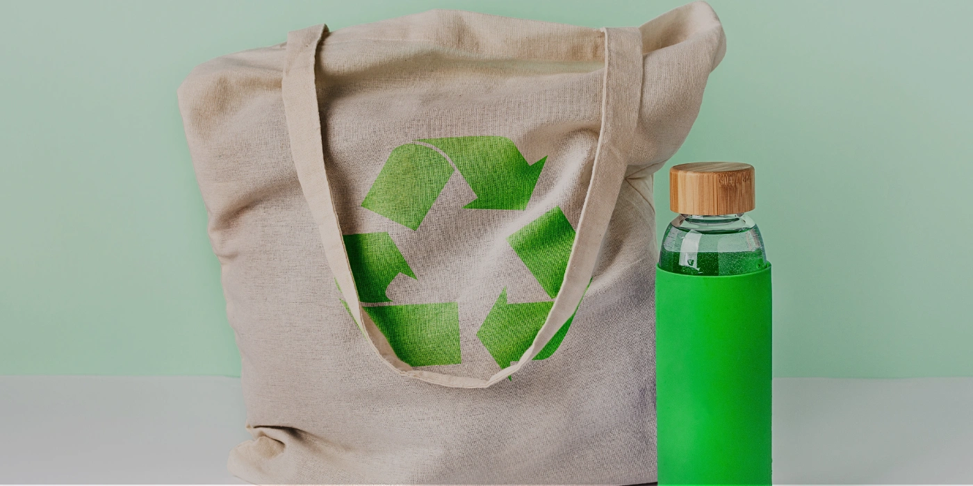 Reusable water bottle and cloth bag, promoting sustainable practices in Tabin Wildlife Reserve