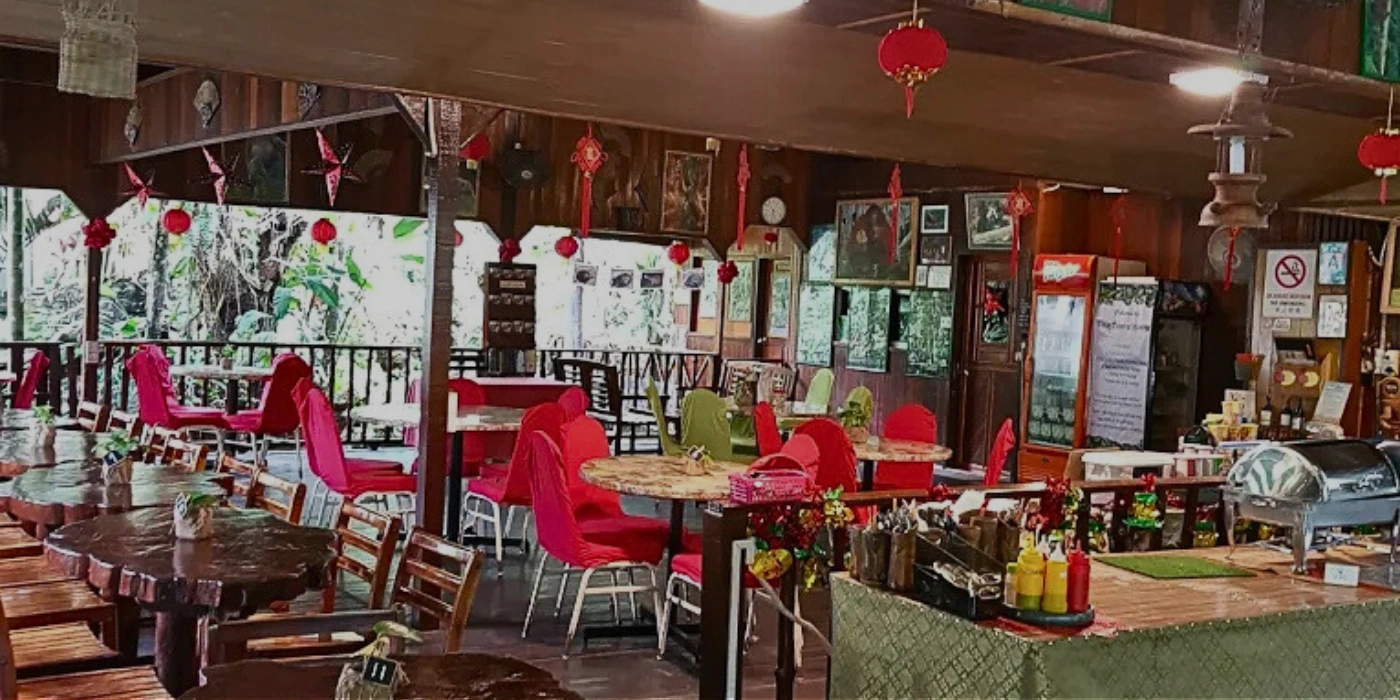 Cozy interior of Sepilok Jungle Resort Restaurant, a popular lunch spot during Sepilok tour