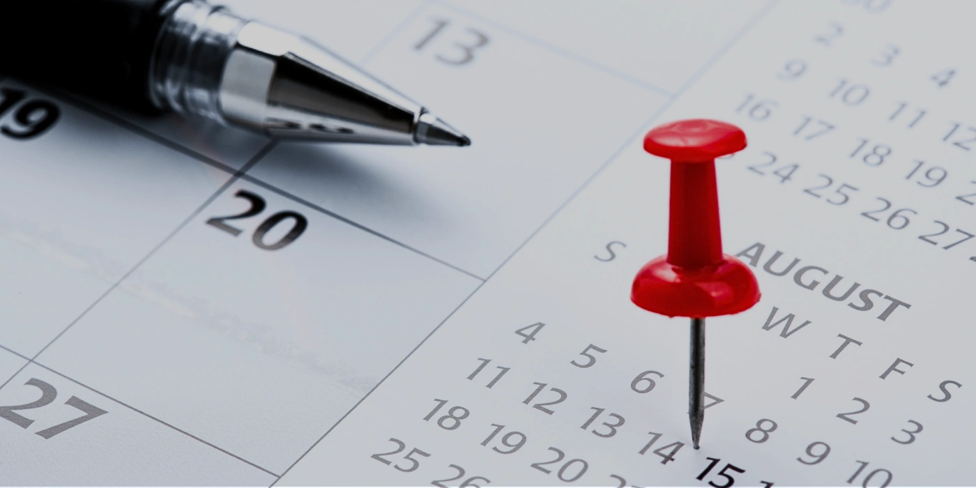 Calendar page with a bullet pin marking a date, symbolizing the best time to visit Tabin in Sabah