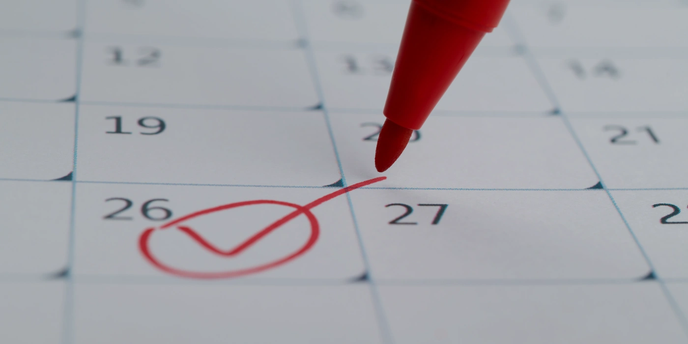 A person marking his calendar to determine the best time to visit bako national park